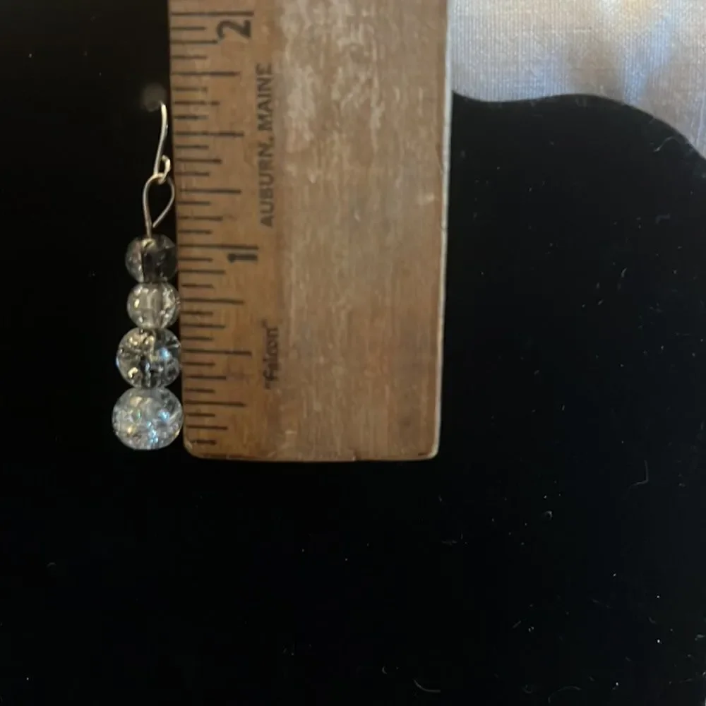 Handcrafted silver tone and glass bead earrings.